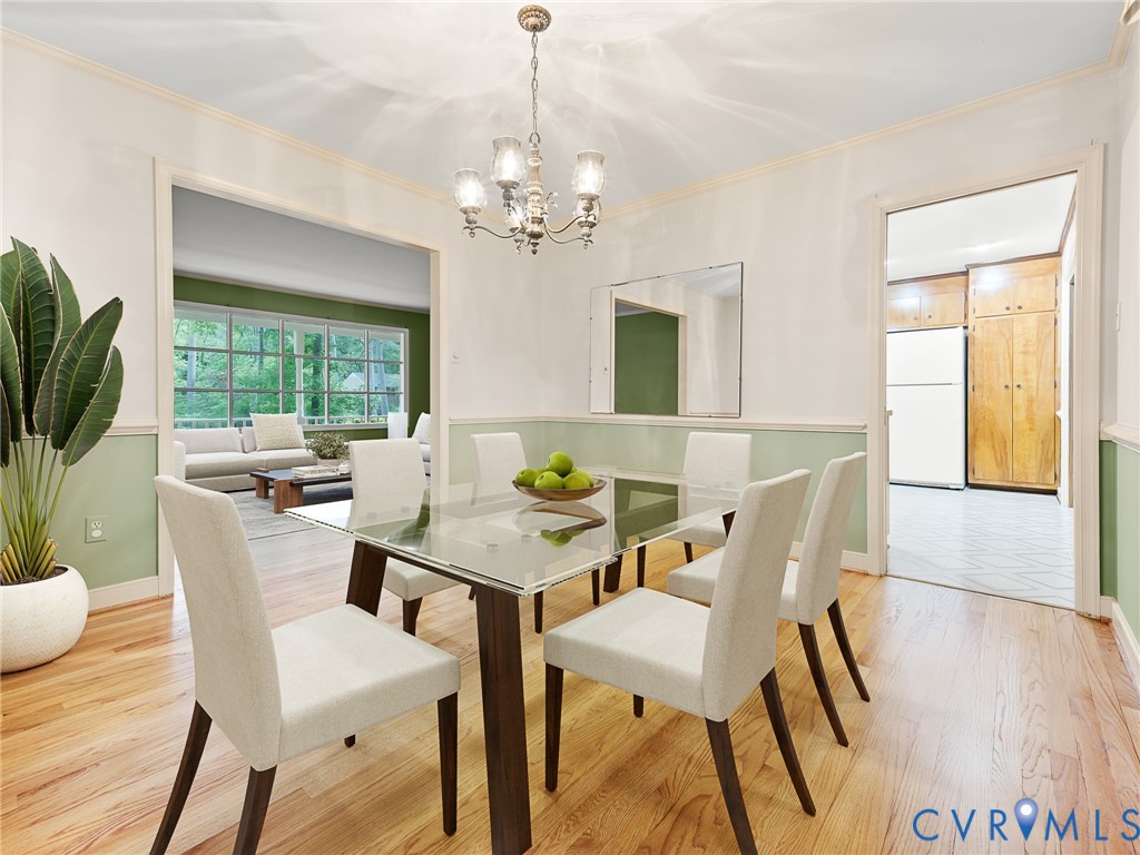 12911 Percival Street Chester, VA 23831 - Photo 6 of 21 a view of a dining room with furniture and a chandelier