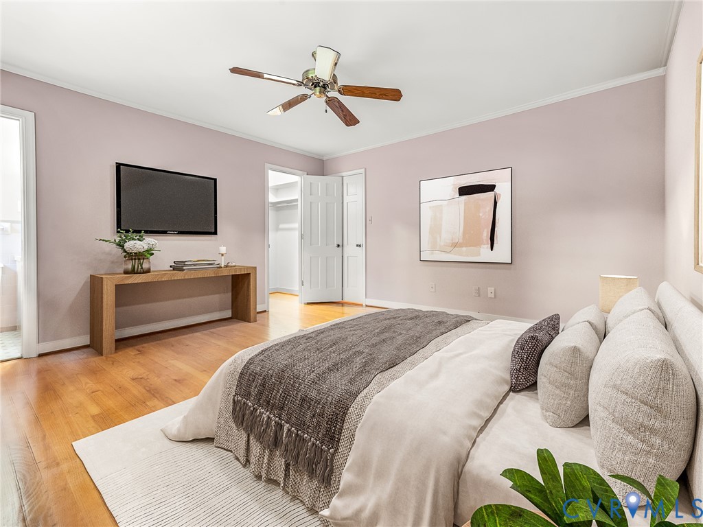 12911 Percival Street Chester, VA 23831 - Photo 7 of 21 a spacious bedroom with a bed and a flat screen tv