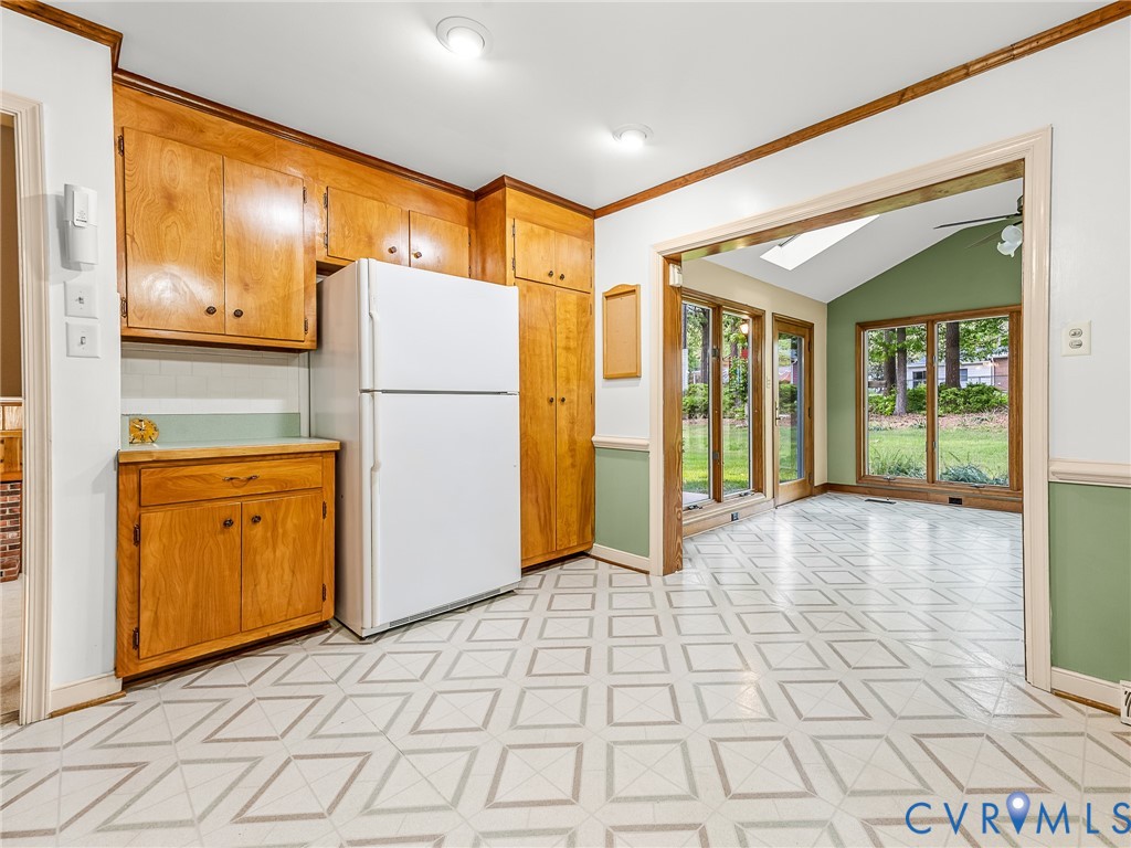 12911 Percival Street Chester, VA 23831 - Photo 10 of 21 a view of a refrigerator in kitchen and an empty room