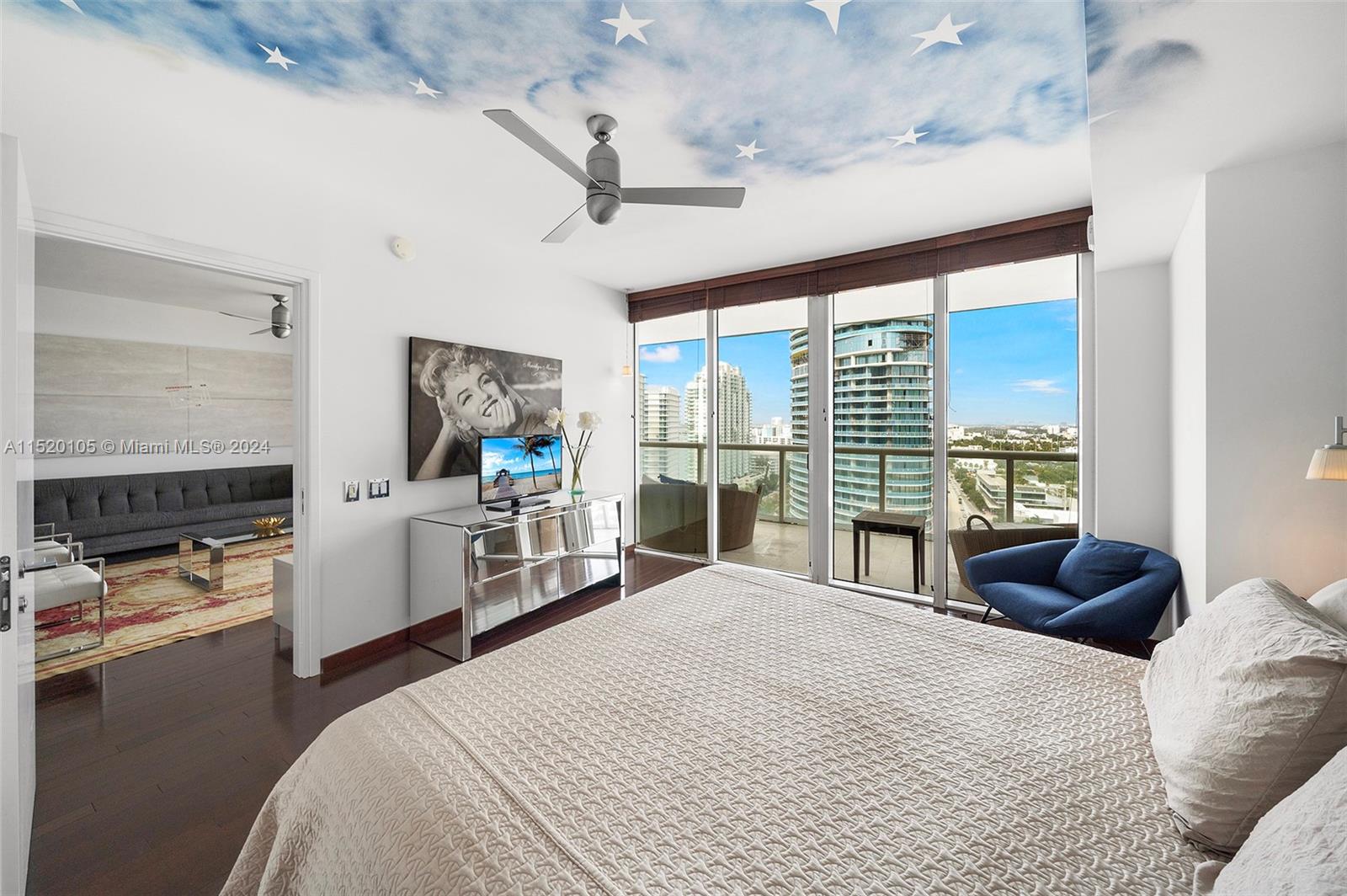 450 Alton Road, Unit 2006 Miami Beach, FL 33139 - Photo 15 of 51 a bedroom with a bed and a large window