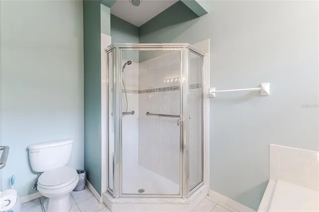 a view of a room with windows and stairs