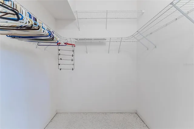 a kitchen with cabinets stainless steel appliances and a counter space