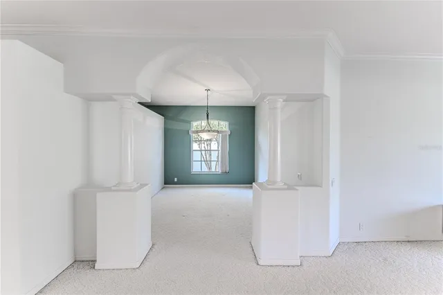a kitchen with stainless steel appliances granite countertop a sink and white cabinets