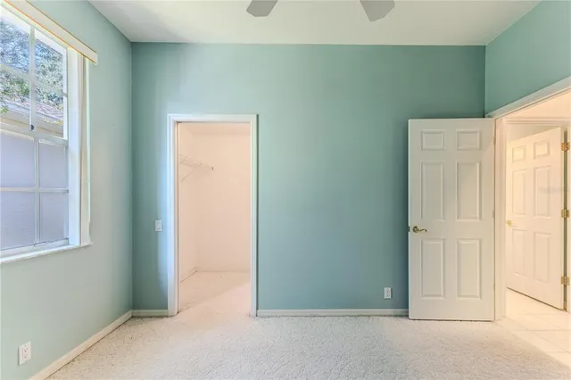 a view of a house with backyard and garden