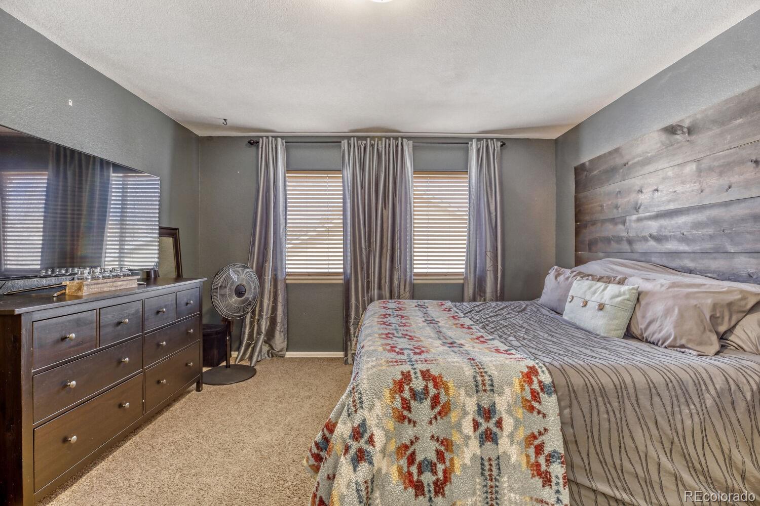 2179 Fletcher Avenue Brighton, CO 80603 - Photo 16 of 29 a bedroom with a bed and a dresser
