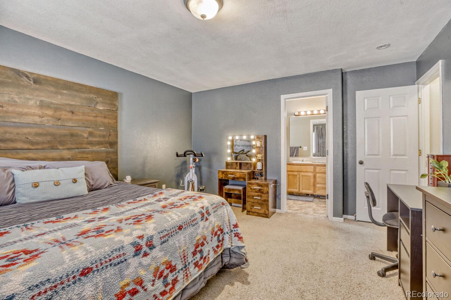 2179 Fletcher Avenue Brighton, CO 80603 - Photo 17 of 29 a bedroom with a bed and furniture