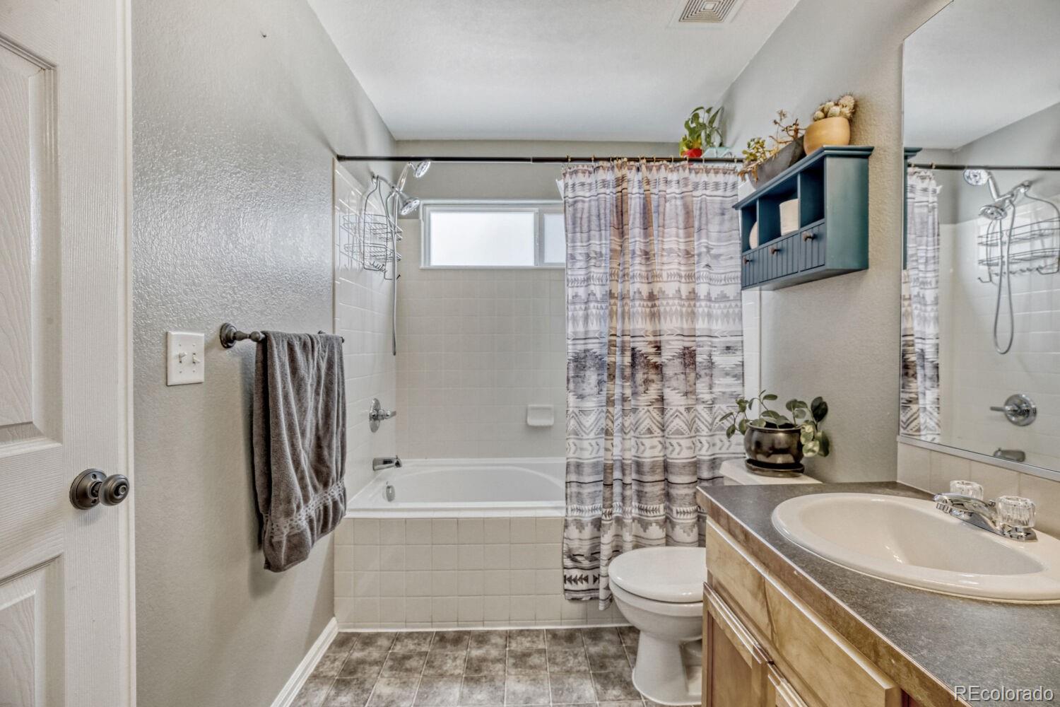 2179 Fletcher Avenue Brighton, CO 80603 - Photo 18 of 29 a bathroom with a sink toilet and shower
