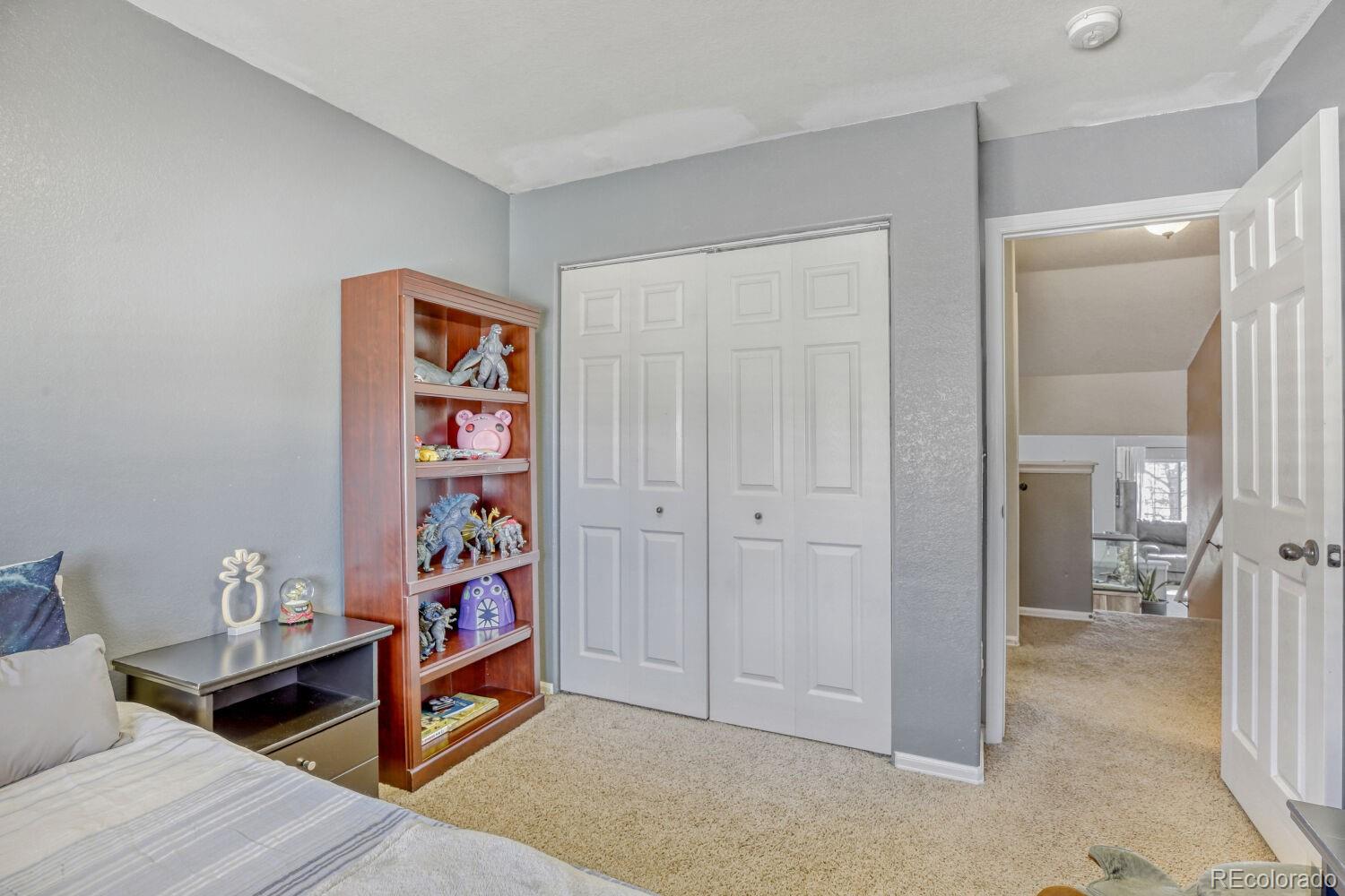 2179 Fletcher Avenue Brighton, CO 80603 - Photo 20 of 29 a view of a hallway to a livingroom and a livingroom with furniture