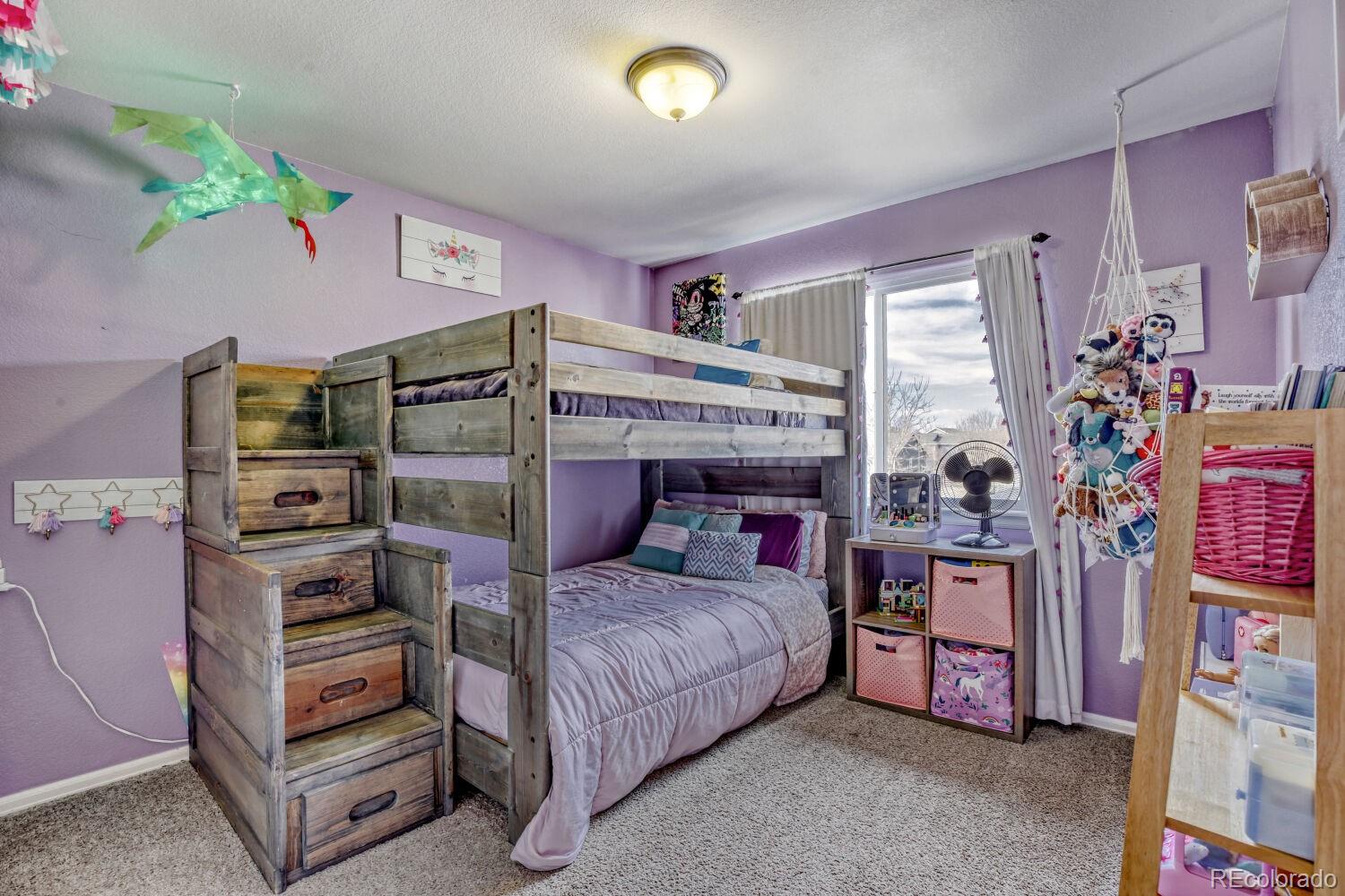 2179 Fletcher Avenue Brighton, CO 80603 - Photo 21 of 29 a bedroom with a bed and a window