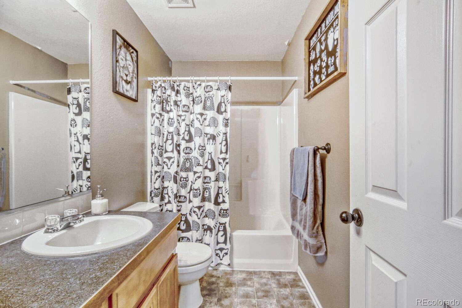 2179 Fletcher Avenue Brighton, CO 80603 - Photo 23 of 29 a bathroom with a sink a toilet and shower