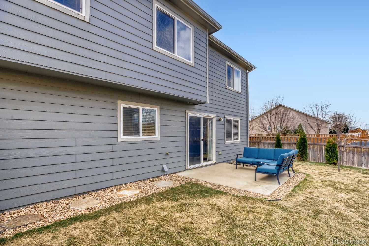 2179 Fletcher Avenue Brighton, CO 80603 - Photo 26 of 29 a view of a house with a yard and wooden fence