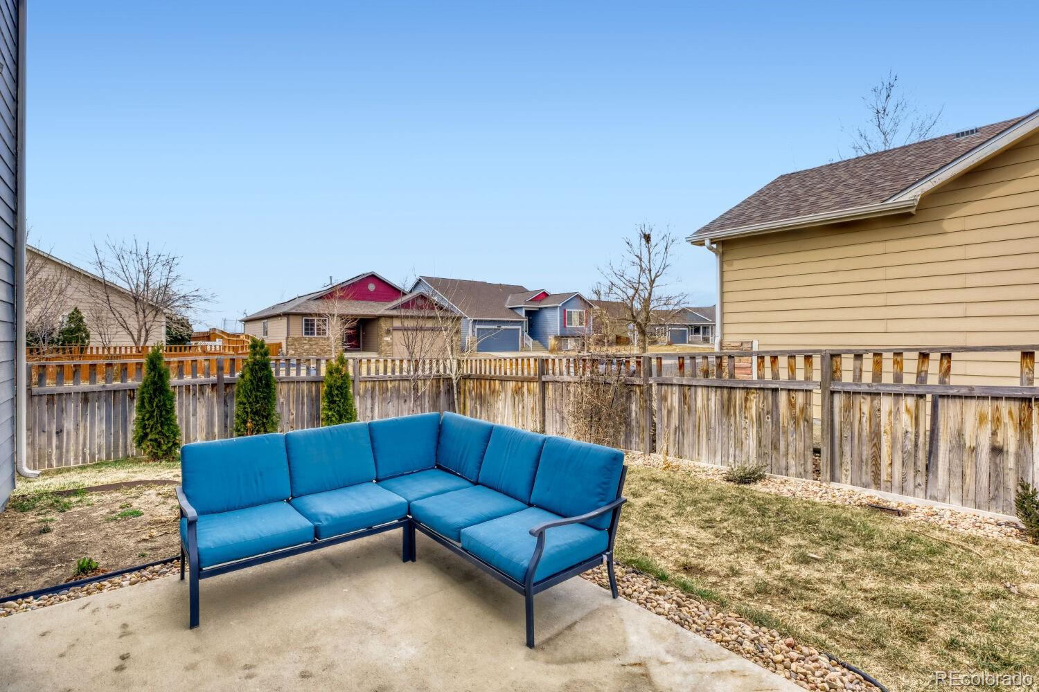 2179 Fletcher Avenue Brighton, CO 80603 - Photo 28 of 29 a view of roof deck with a barbeque and wooden stairs