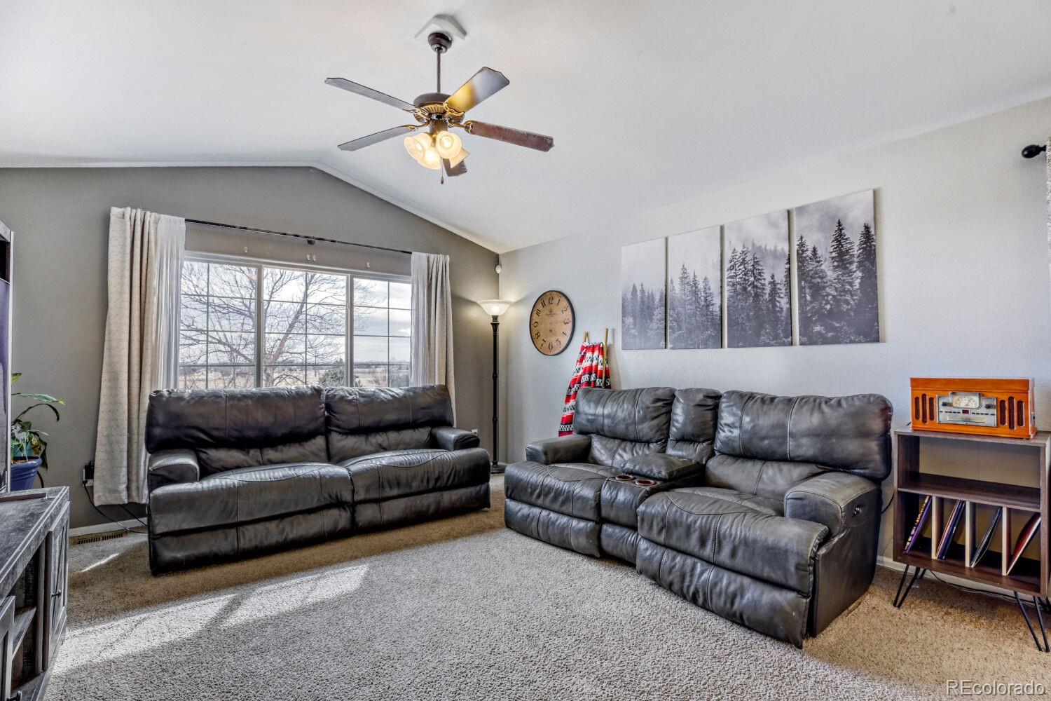 2179 Fletcher Avenue Brighton, CO 80603 - Photo 5 of 29 a living room with furniture and a large window