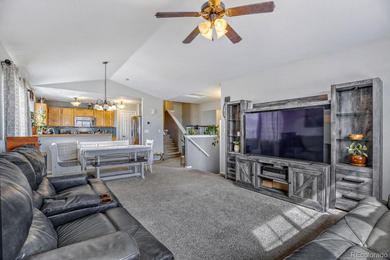 2179 Fletcher Avenue Brighton, CO 80603 - Photo 7 of 29 a living room with furniture and a flat screen tv