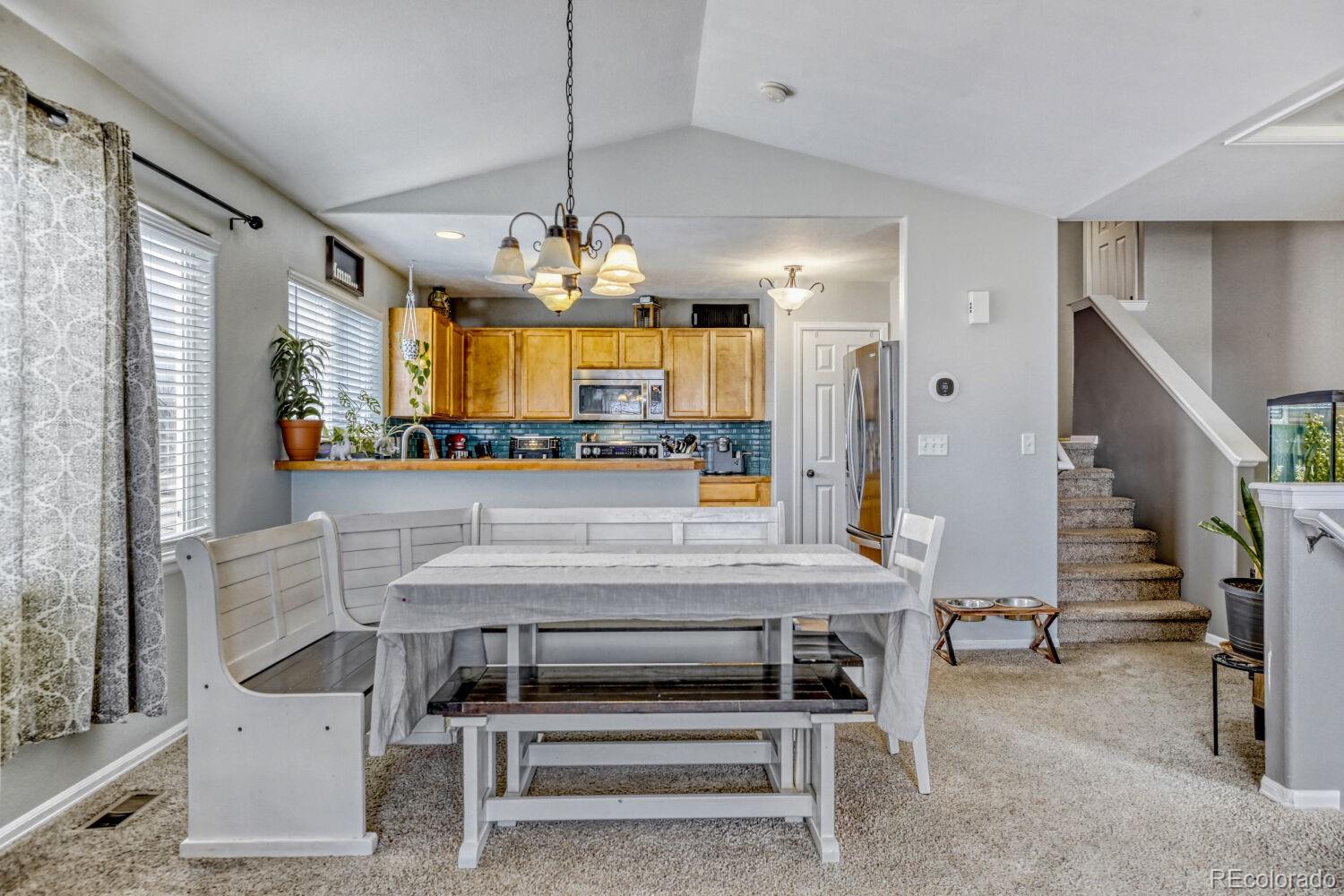 2179 Fletcher Avenue Brighton, CO 80603 - Photo 9 of 29 a view of dining room with furniture and chandelier