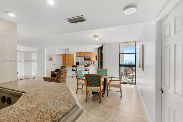 a en suite bathroom with a double vanity sink and a mirror
