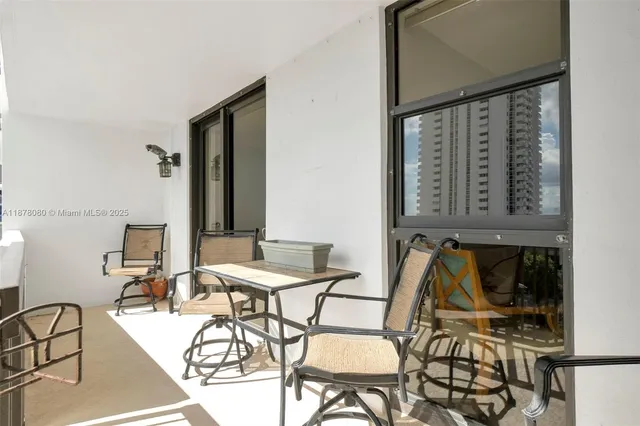 a lobby with furniture and a large mirror