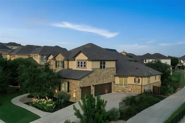 a view of a dining room and livingroom with furniture wooden floor a chandelier