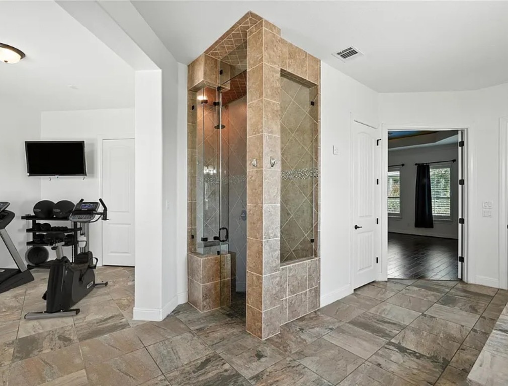 15729 De Fortuna Drive Bee Cave, TX 78738 - Photo 17 of 40 Full bath with a shower stall and baseboards