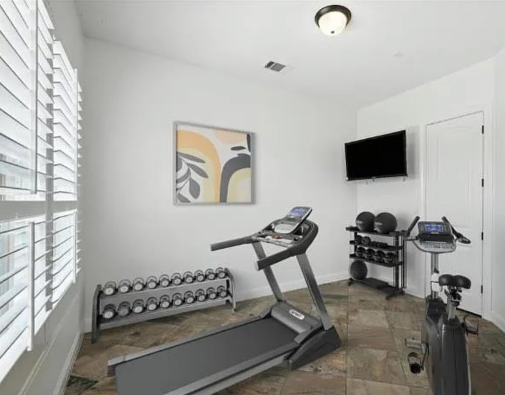 15729 De Fortuna Drive Bee Cave, TX 78738 - Photo 18 of 40 Exercise room featuring baseboards