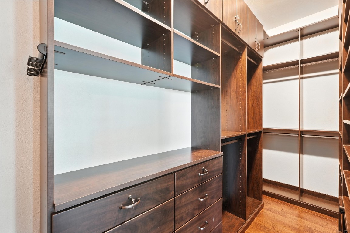 15729 De Fortuna Drive Bee Cave, TX 78738 - Photo 20 of 40 a view of walk in closet with clothes and shoes