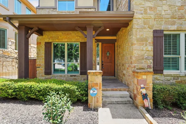 a view of living room with furniture and floor to ceiling window