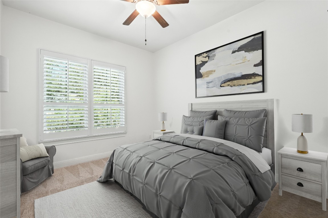 15729 De Fortuna Drive Bee Cave, TX 78738 - Photo 21 of 40 Carpeted bedroom featuring a ceiling fan and baseboards