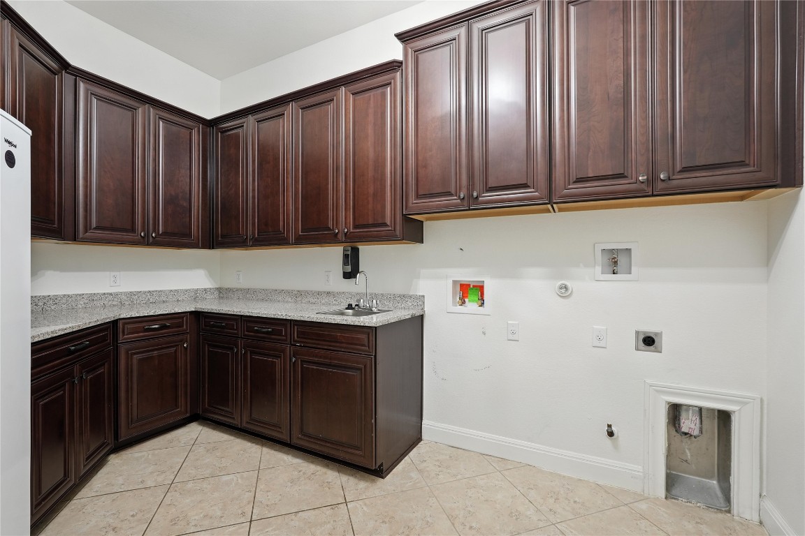 15729 De Fortuna Drive Bee Cave, TX 78738 - Photo 24 of 40 a kitchen with a sink and cabinets