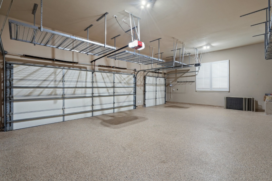 15729 De Fortuna Drive Bee Cave, TX 78738 - Photo 36 of 40 Garage featuring a garage door opener