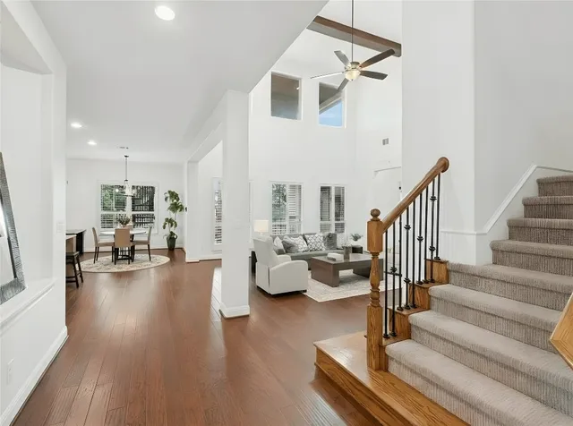 a kitchen with counter top space and living room view