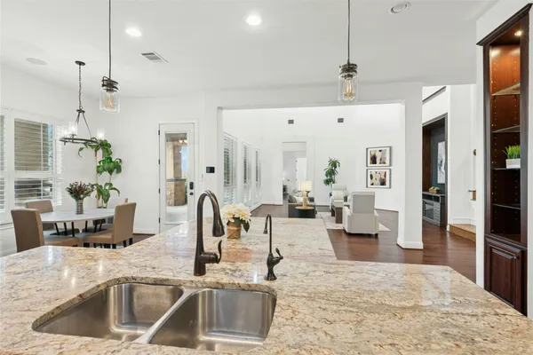 a kitchen with a sink and cabinets