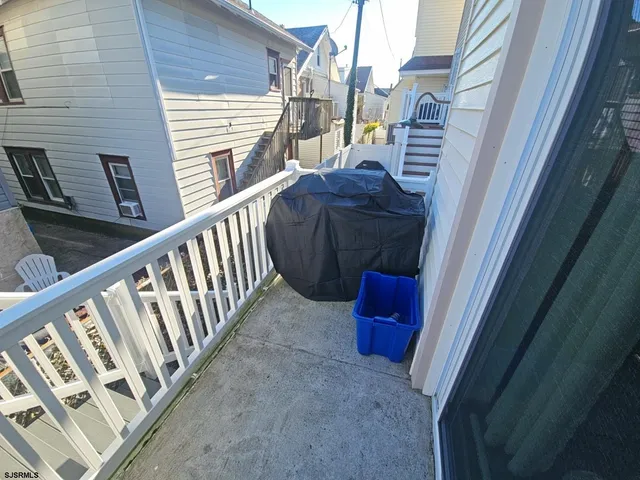 a view of balcony with a potted plant