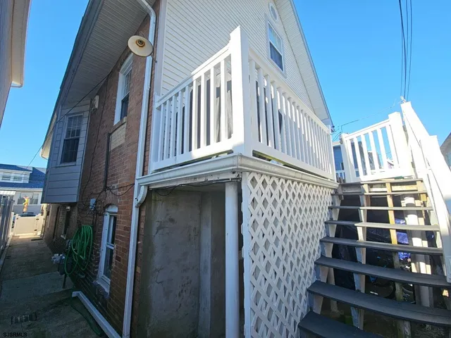 a view of a building with stairs and door