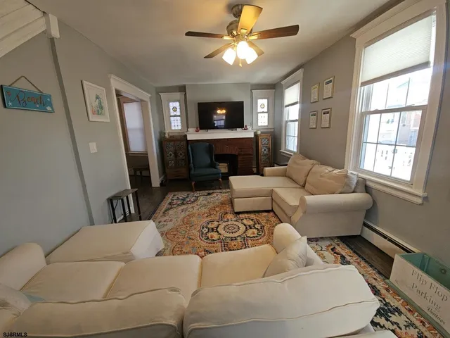 a living room with furniture and a window