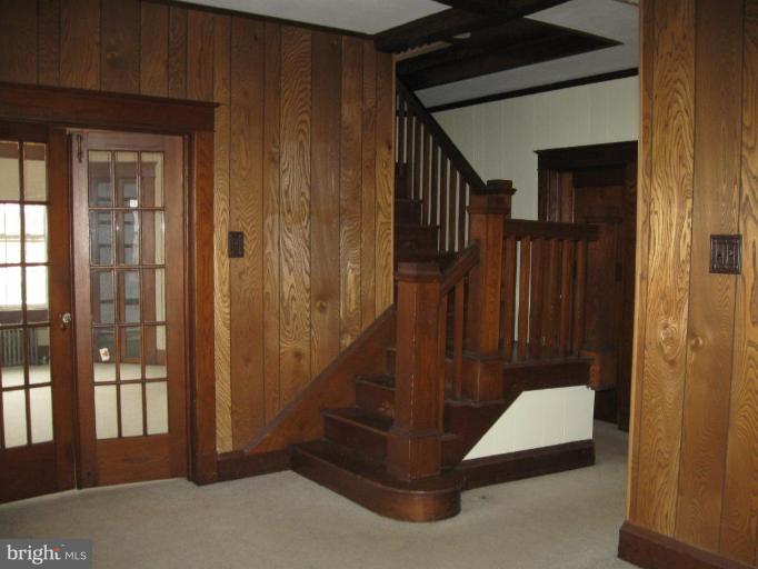 2121 White Hall Road White Hall, MD 21161 - Photo 7 of 20 a view of a hallway with a door and stairs