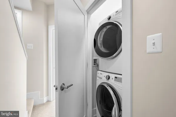 an empty room with closet and a bathroom