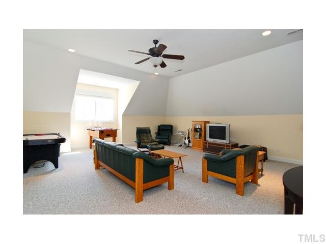 7000 Potomac Court Raleigh, NC 27613 - Photo 12 of 18 a living room with furniture and a fireplace