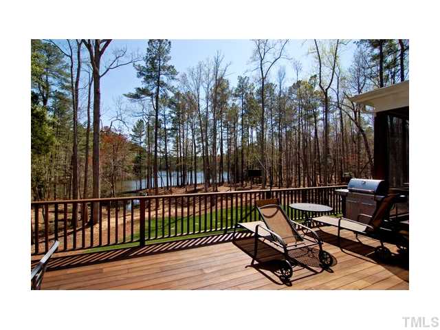 7000 Potomac Court Raleigh, NC 27613 - Photo 18 of 18 a terrace with a bench and trees