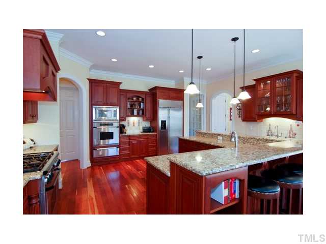 7000 Potomac Court Raleigh, NC 27613 - Photo 5 of 18 a open kitchen view with granite countertop a sink counter top space and living room view