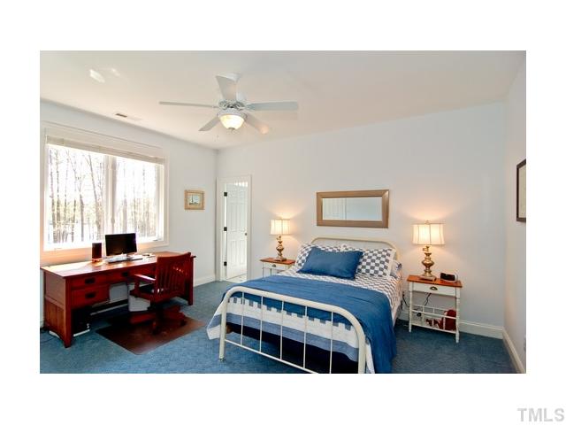 7000 Potomac Court Raleigh, NC 27613 - Photo 10 of 18 a bedroom with a bed and a table