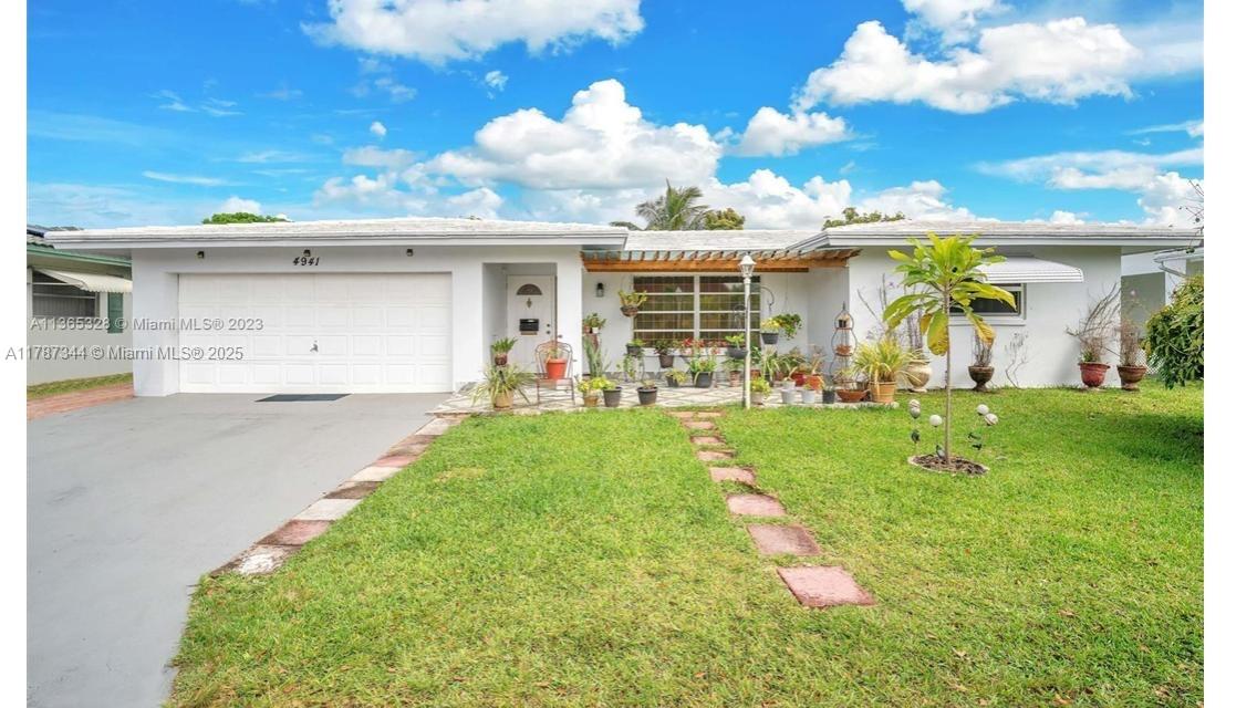 a front view of a house with garden