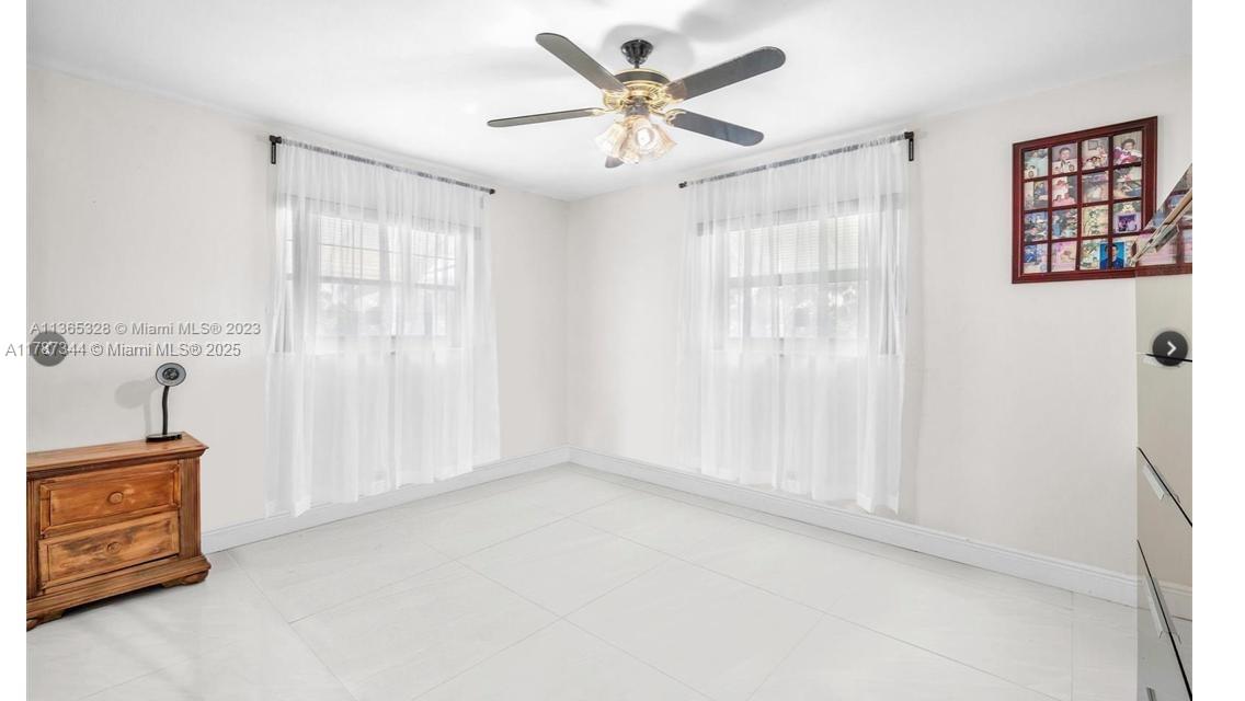 4941 Northwest 55th Court Tamarac, FL 33319 - Photo 22 of 30 a view of an empty room with a window