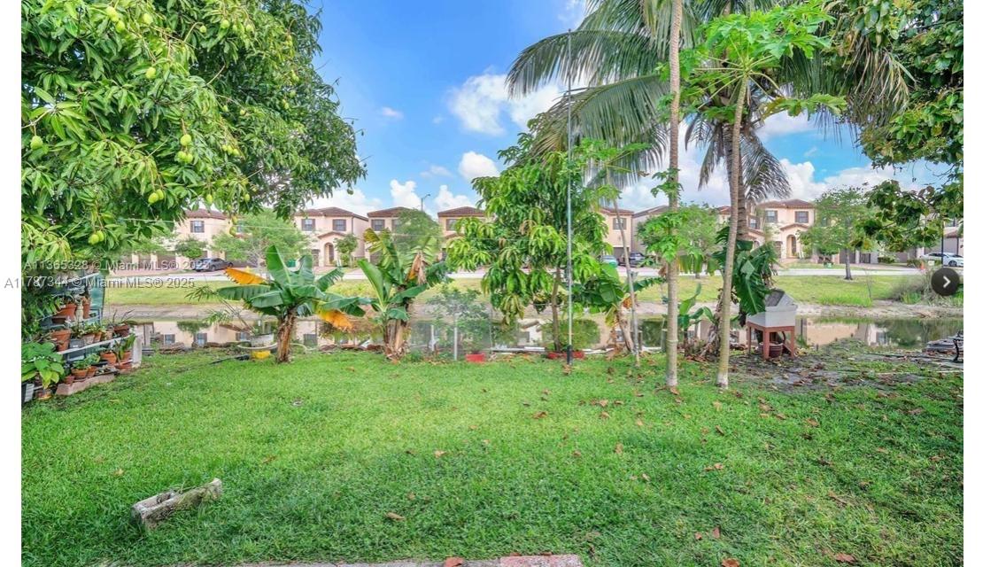 4941 Northwest 55th Court Tamarac, FL 33319 - Photo 30 of 30 a view of a chair and table of the garden
