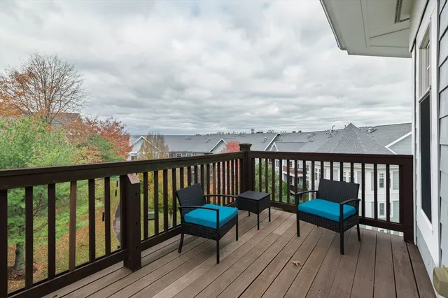 a view of a chairs on wooden deck