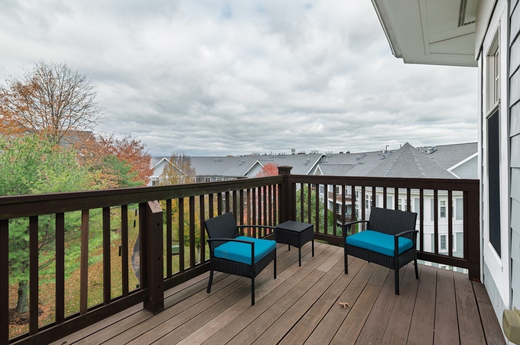 501 Commerce Drive, Unit 2310 Braintree, MA 02184 - Photo 13 of 23 a view of a chairs on wooden deck