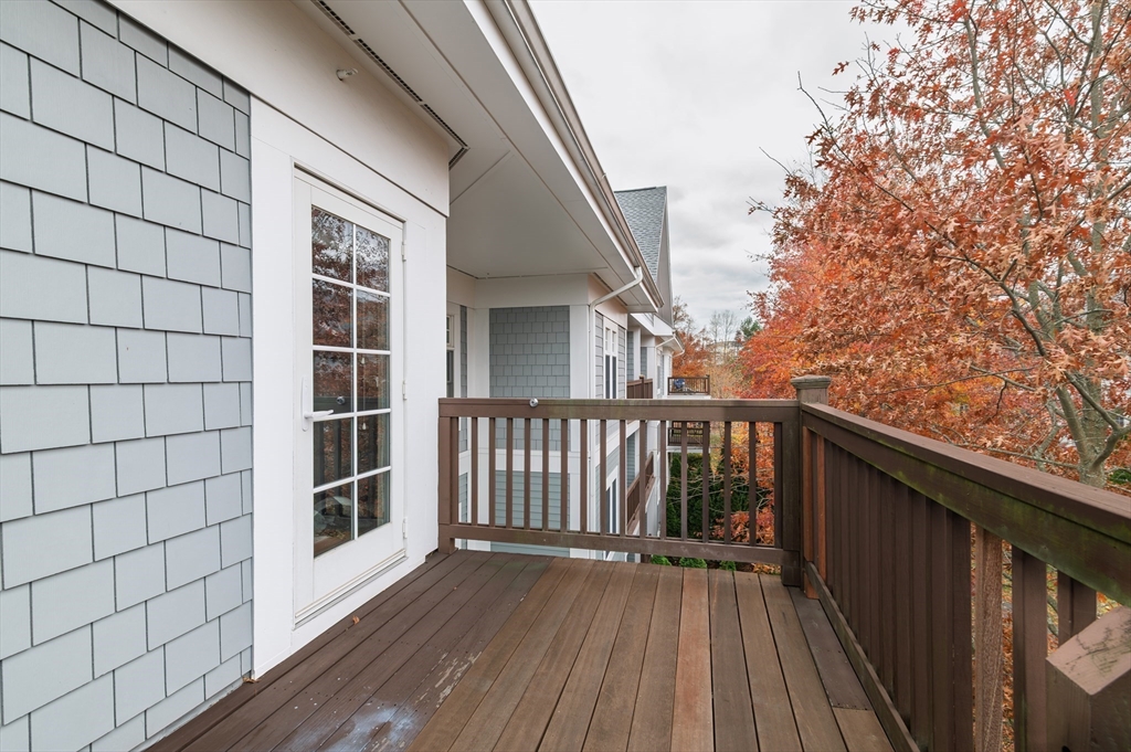 501 Commerce Drive, Unit 2310 Braintree, MA 02184 - Photo 14 of 23 a view of balcony with wooden floor and fence and a floor to ceiling window