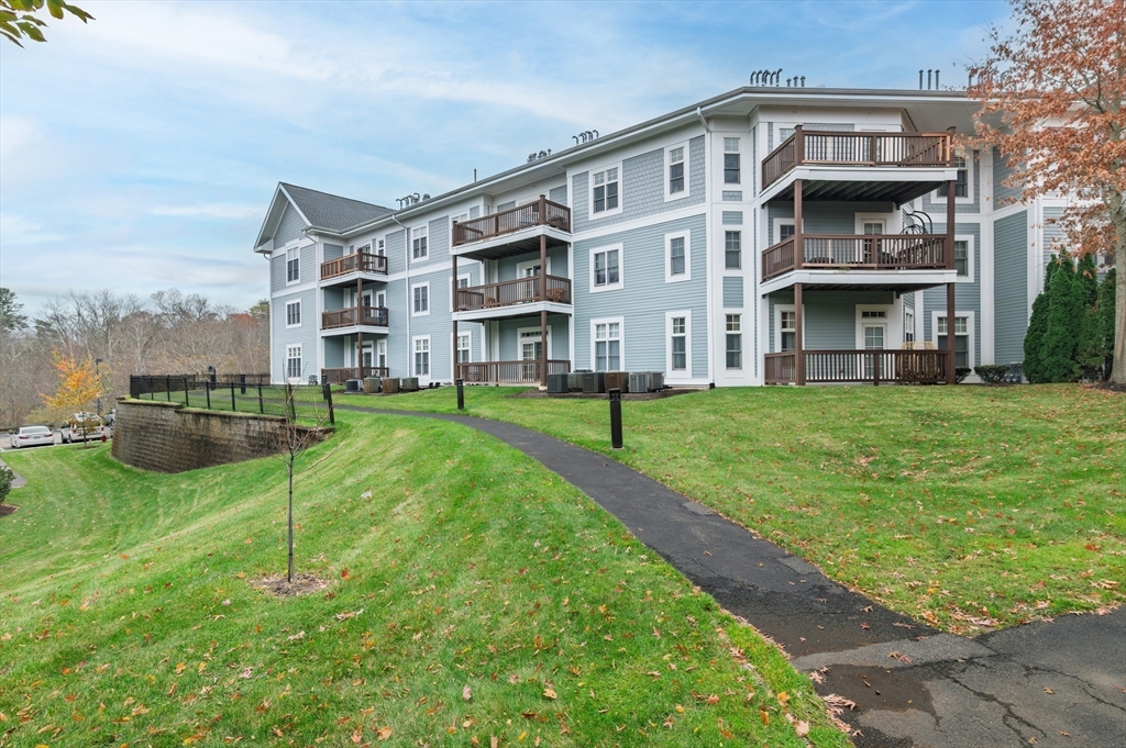 501 Commerce Drive, Unit 2310 Braintree, MA 02184 - Photo 19 of 23 a view of building with a yard