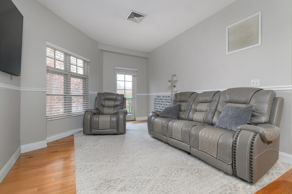 501 Commerce Drive, Unit 2310 Braintree, MA 02184 - Photo 4 of 23 a living room with furniture and a window