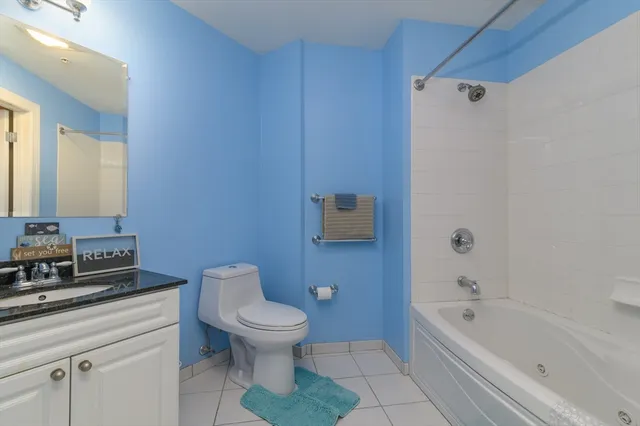 a bathroom with a toilet a sink and bathtub