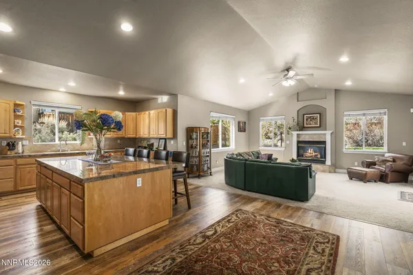 a kitchen with stainless steel appliances granite countertop a stove and cabinets